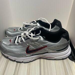 Nike Initiator size 11.5 men’s Silver and Red tennis shoes .